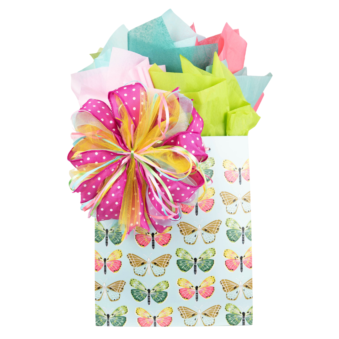 Butterfly patterned gift bag with matching pink, green, and blue tissue paper and bow