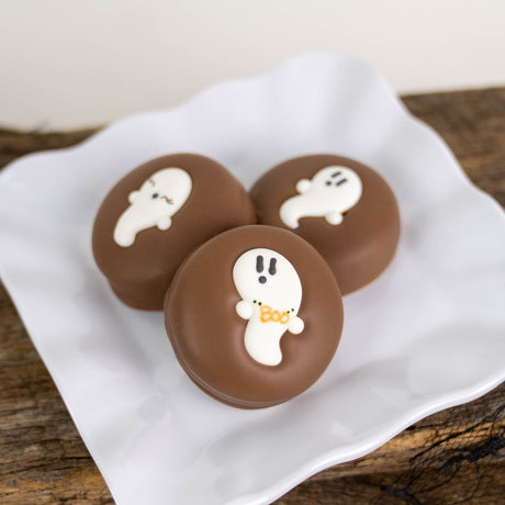 Nabisco Oreo double dipped in creamy milk chocolate with hand-drawn ghost detail – festive Halloween cookie from Nibbles & Bits in Scranton, PA.