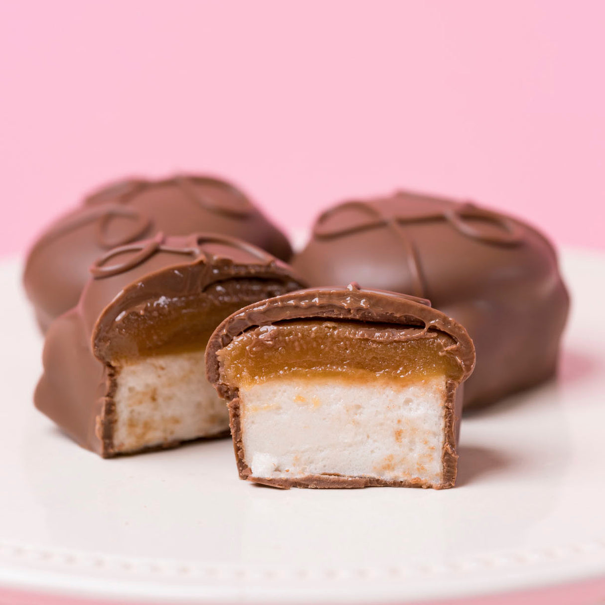Caramel marshmallow milk chocolate candy with fluffy marshmallow and gooey caramel layers.