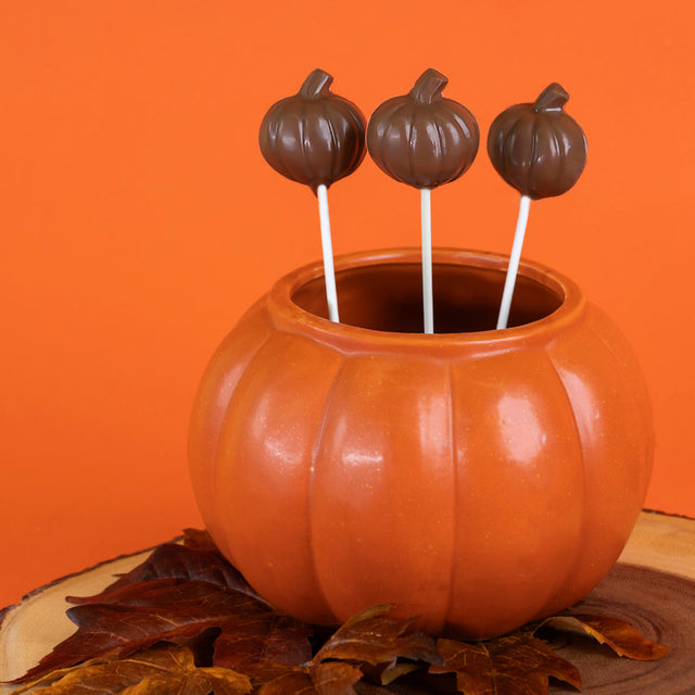 Handcrafted milk chocolate mini pumpkin lollipop – festive fall candy pop shaped like a pumpkin from Nibbles & Bits.
