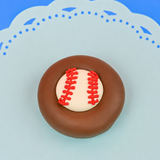 Single milk chocolate covered Oreo decorated with a white fondant baseball and hand-piped red lace stitching on a mint green decorative plate with blue background, handmade sports gift by Nibbles and Bits Scranton PA.
