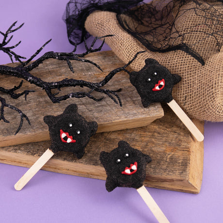 Milk chocolate covered Nabisco Oreo with mini Oreos for bat wings – festive handmade Halloween cookie from Nibbles & Bits in Scranton, PA.