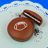 Milk chocolate football Oreo with dark chocolate cookie layers and white cream filling on a mint green plate, handcrafted sports themed chocolate gift by Nibbles and Bits Scranton PA.