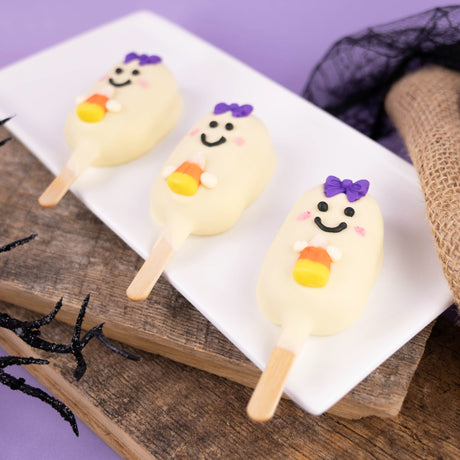 Friendly ghost pop filled with peanut butter crème and coated in white chocolate – handmade Halloween candy from Nibbles & Bits in Scranton, PA.