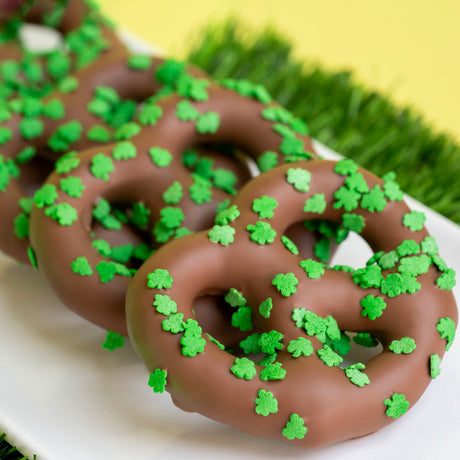 Snyder’s Olde Tyme lightly salted pretzels double dipped in creamy milk chocolate and topped with green shamrock confetti sprinkles for St. Patrick’s Day.