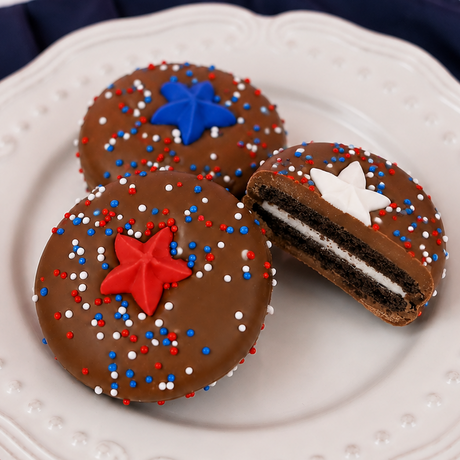 Milk chocolate covered Oreo decorated with red, white and blue nonpareils and a red fondant star decal, patriotic Fourth of July treat handmade in Scranton Pennsylvania.