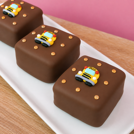 Milk chocolate s'more decorated with a school bus fondant detail and gold icing dots on top, handmade back to school treat by Nibbles and Bits Scranton PA.