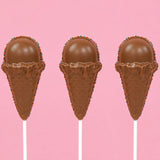 Three solid milk chocolate ice cream cone pops showing detailed molded waffle cone and rounded scoop with patriotic nonpareil border on white sticks against a pink background, handmade summer treat by Nibbles and Bits Scranton PA.