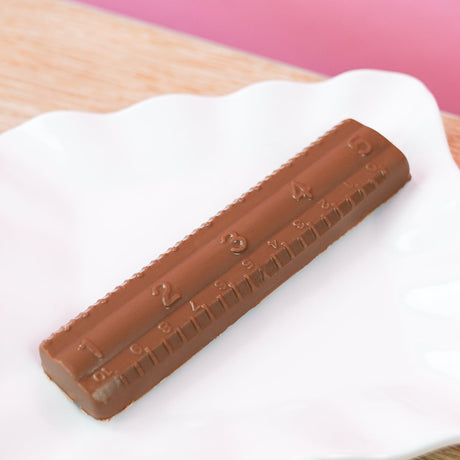 Solid milk chocolate ruler with detailed molded measurement markings, handmade back to school and teacher appreciation gift by Nibbles and Bits Scranton PA.