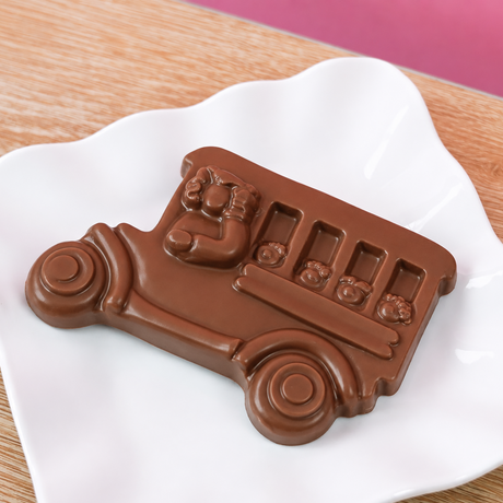 Solid milk chocolate school bus with detailed molded bus driver and children in windows, handmade back to school gift by Nibbles and Bits Scranton PA.
